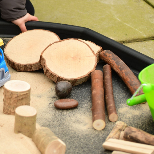 Outdoor Set Of Natural Logs, Poles & Stones